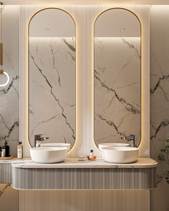 Elegant marble bathroom with twin sinks and contemporary design elements.